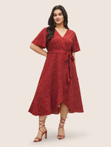 Polka Dot Surplice Neck Belted Arc Hem Dress