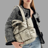 Aurora - Metallic puffer carrier bag with ruffled design