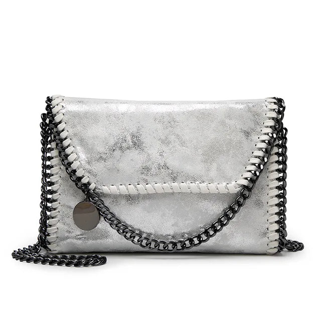 Isabel - Suede clutch with chain embellishment