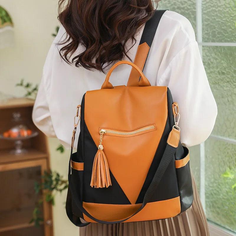 Valencia - Backpack in two-colour look with tassel pendant